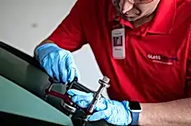 Glass Doctor professional repairing car windshield.