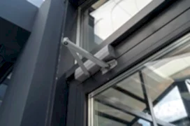 Lever door closer in the office, a device for controlling the process of opening and closing the door, shot close-up