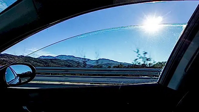 Sun flare shining thru a right window car in movement.