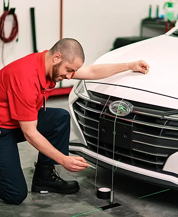 Glass Doctor professional working on cars.