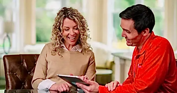 A glass doctor technician with a women customer.
