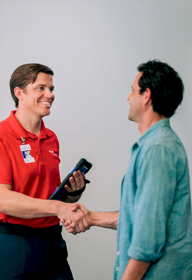 Glass Door professional shaking hands with customer.