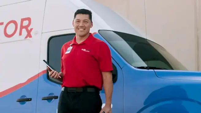 Glass Doctor professional in front of van.
